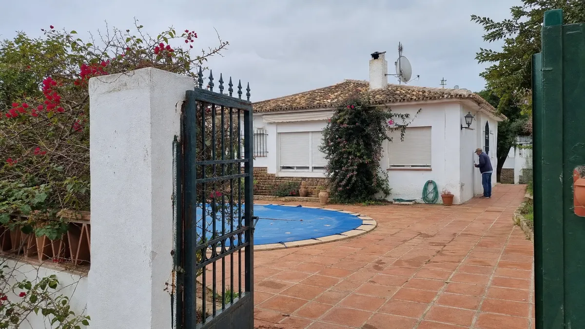A Spanish home with a garden and pool